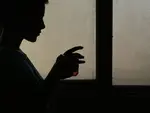 silhouette holding a glass