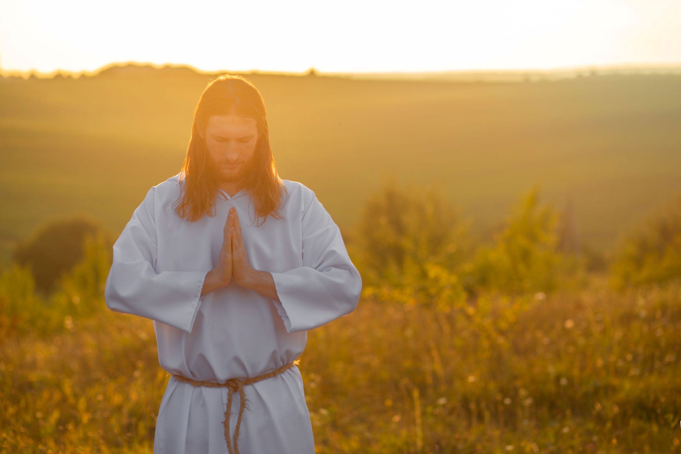 Jesus Christ clasping his hands in prayer. Jesus Christ clasping his hands in prayer.