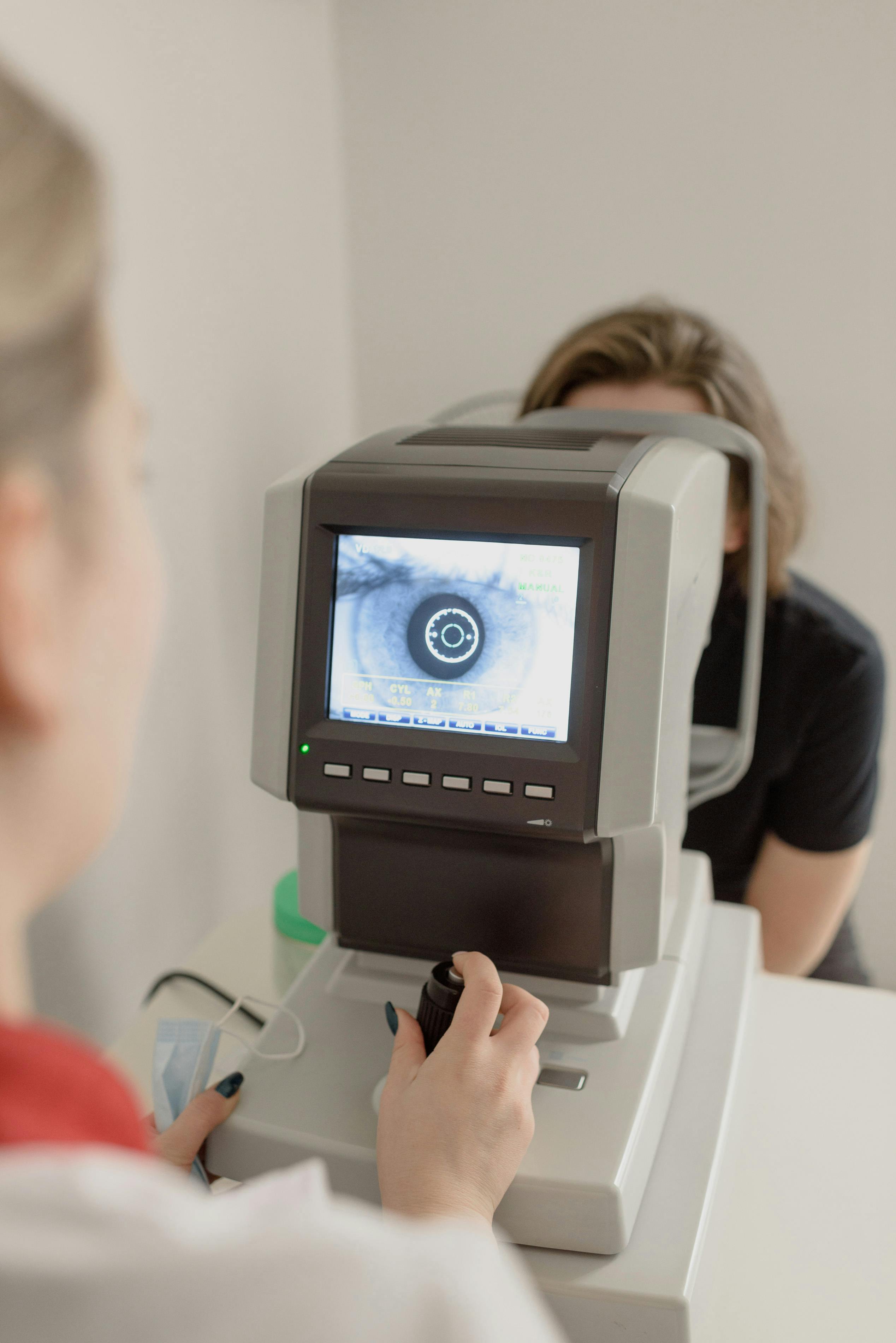 a young woman having an eye exam