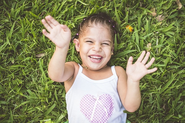 joyful little girl looking upward joyful little girl looking upward