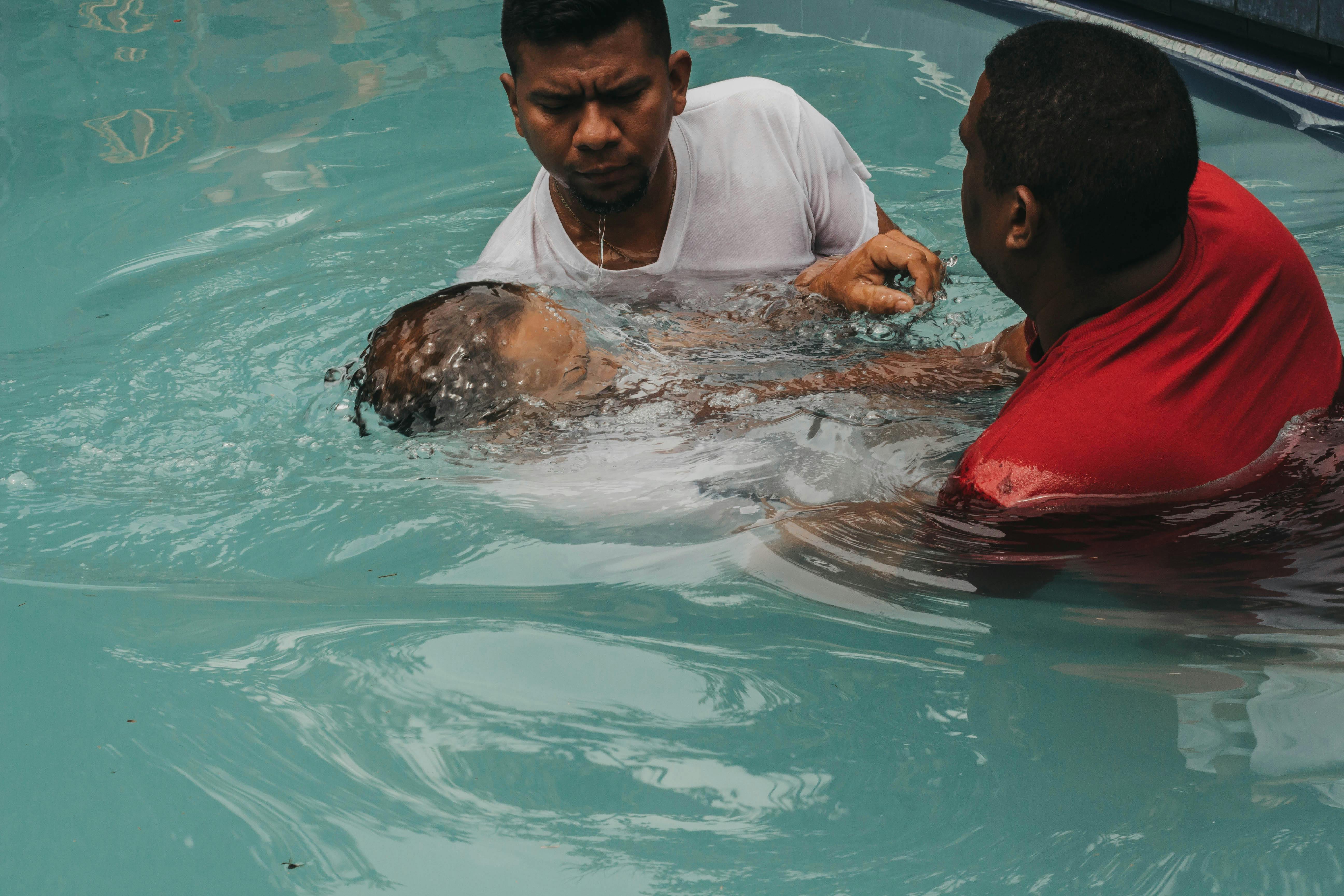 person submitting to Christ in water baptism, rising up to newness of life person submitting to Christ in water baptism, rising up to newness of life